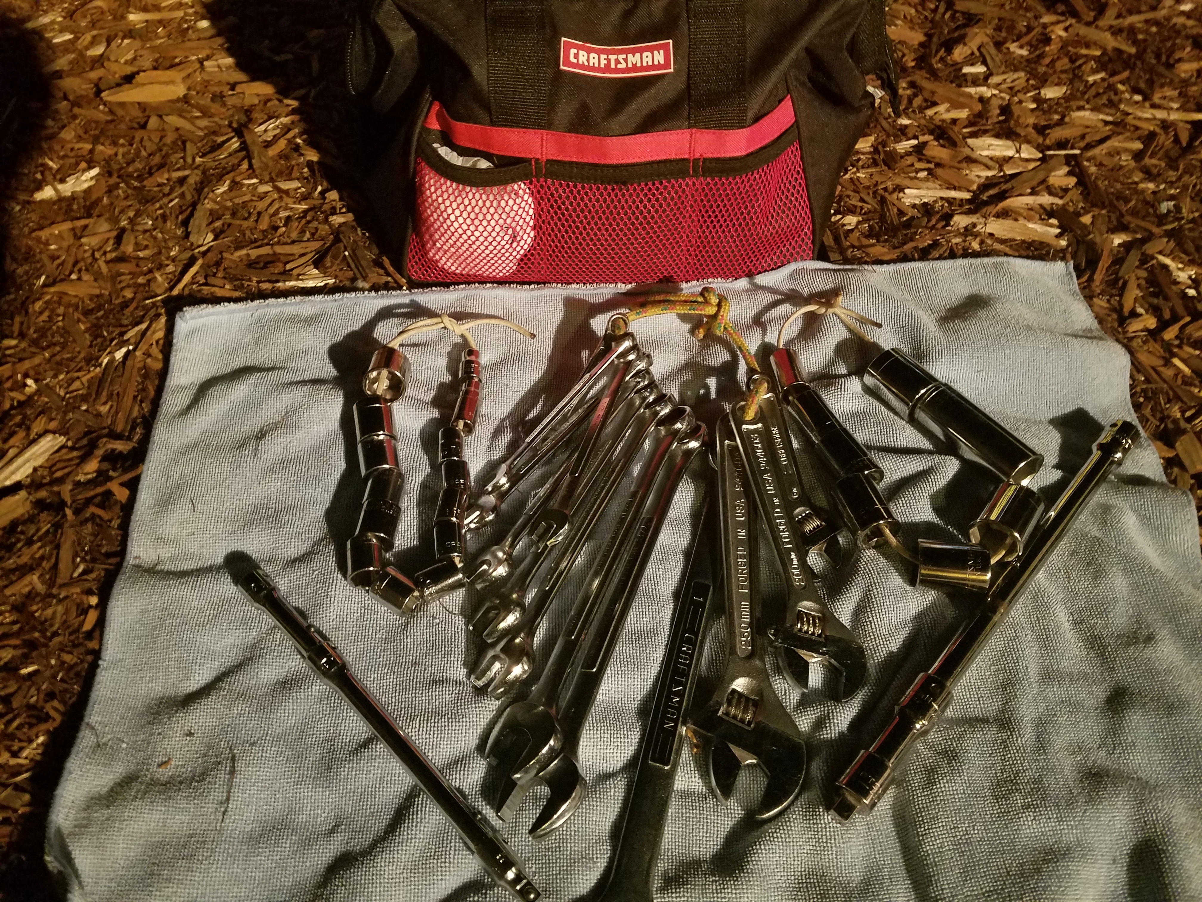 Hack - For tools that don't lend themselves to being corded, such as rachet extensions, snap them together  to make a bigger and less likely to get lost footprint.