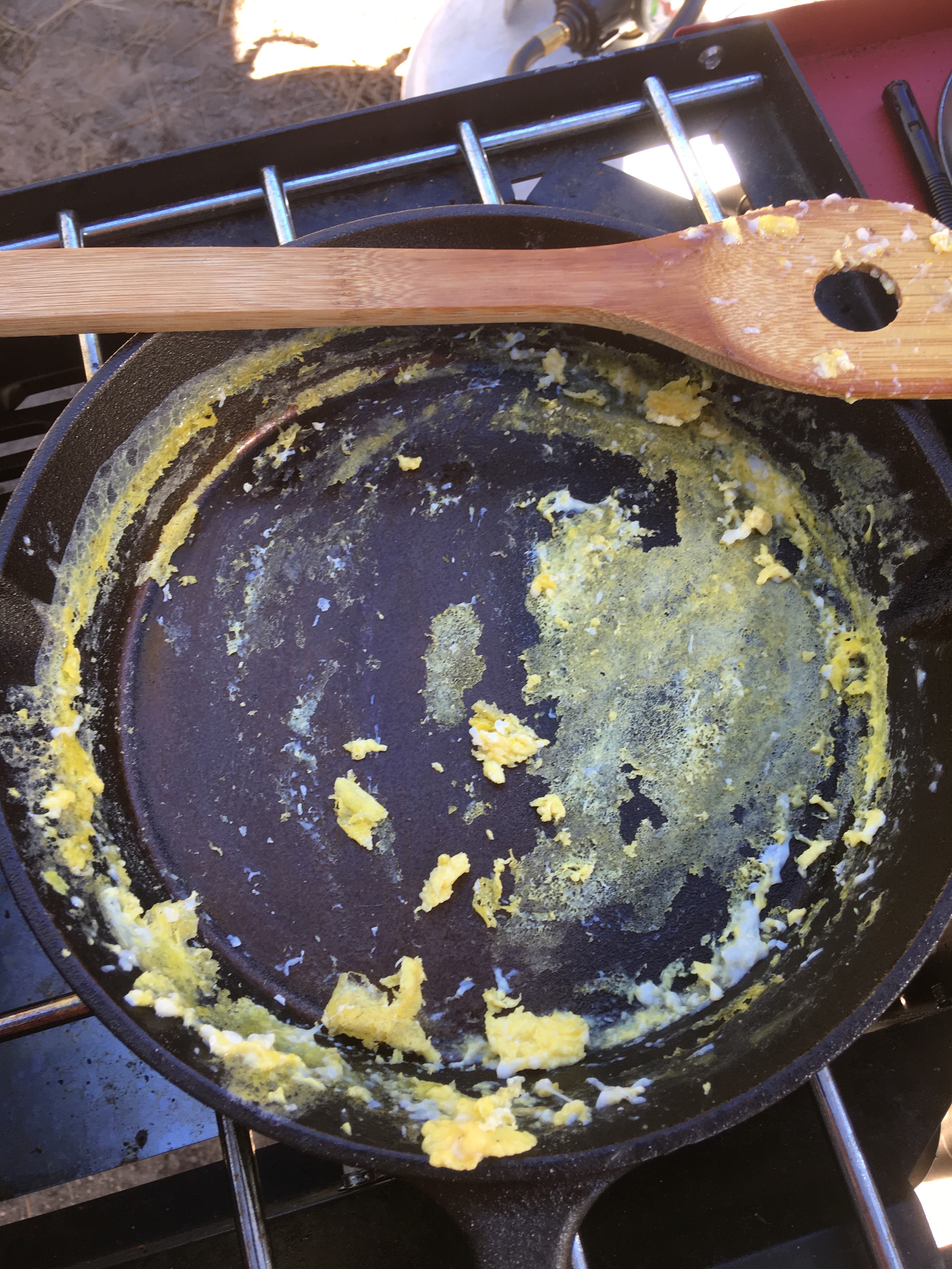 I preheated the pan and added a thin coat of olive oil to the bottom. The egg released easily from the smooth side but stuck to the rough side.
