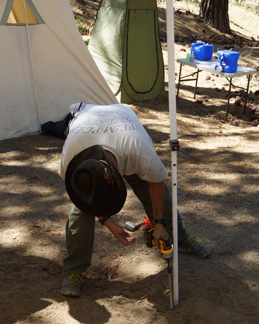 Anchoring the legs of the canopy was serious business.