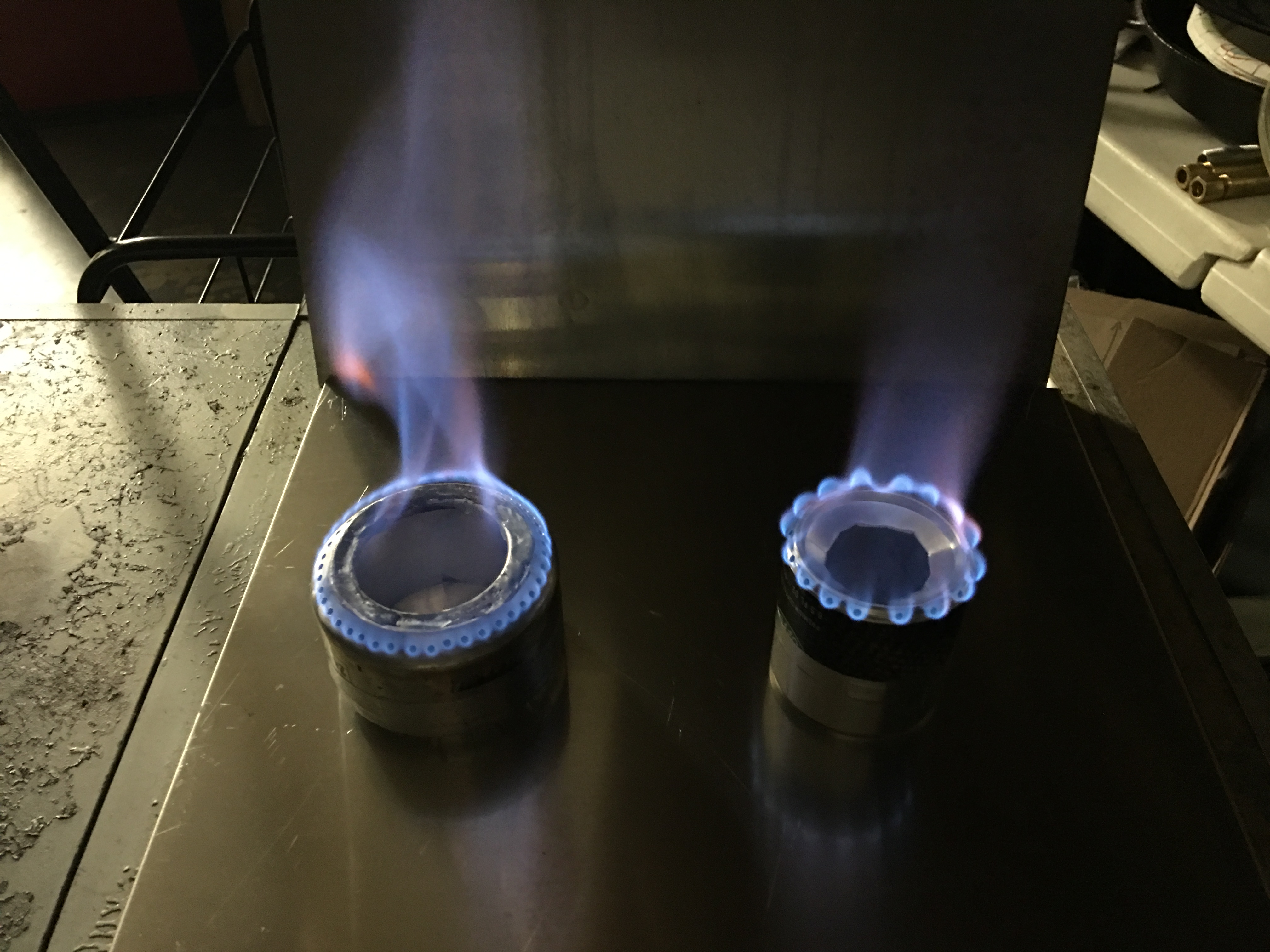 Once stove gets to temperature, the flame will exit the small holes.