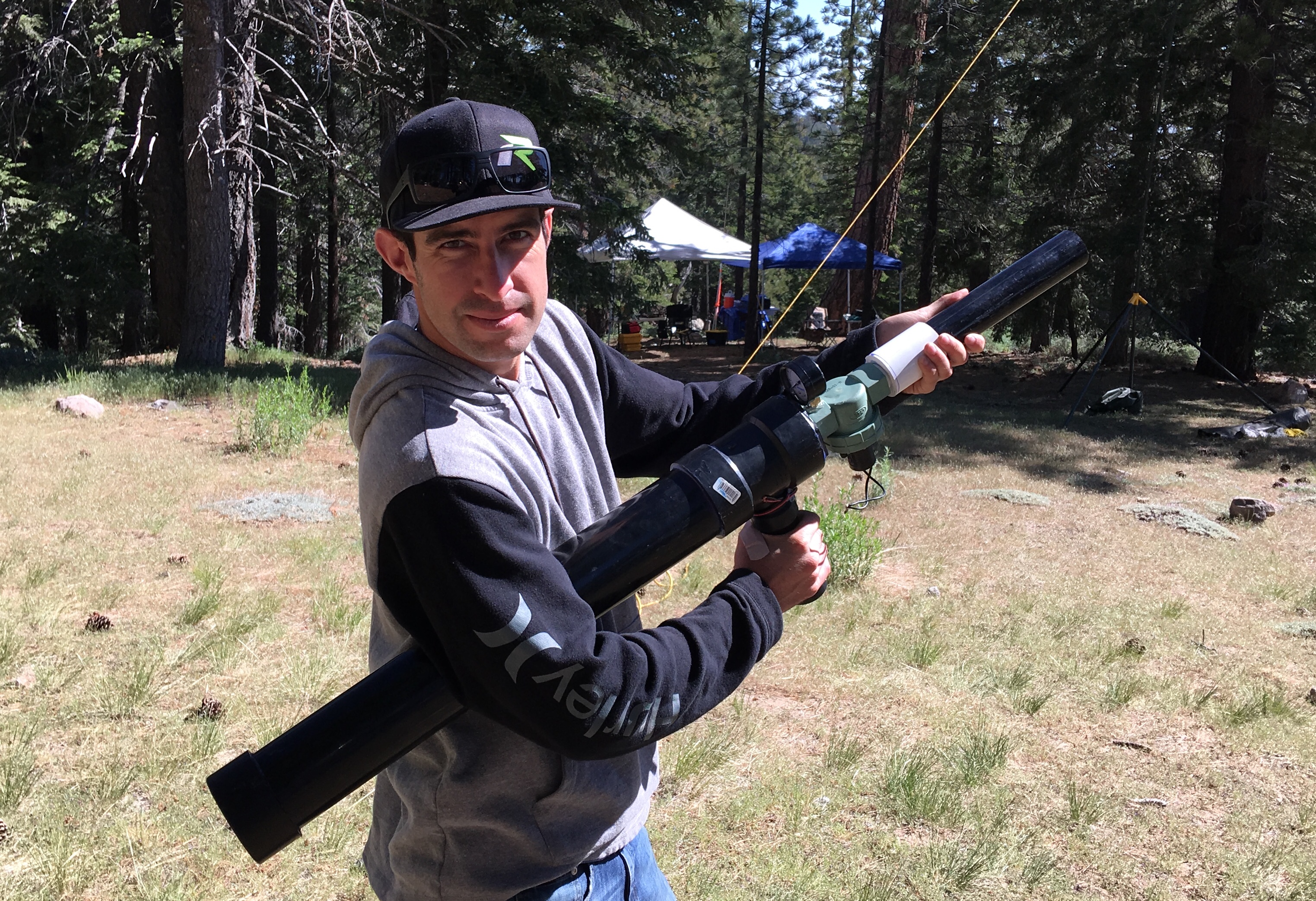 Steven with his pneumatically propelled, manually activated,  antenna hanging device. I think he works for a company called “Acme”! Note the Ham Shack in the background.