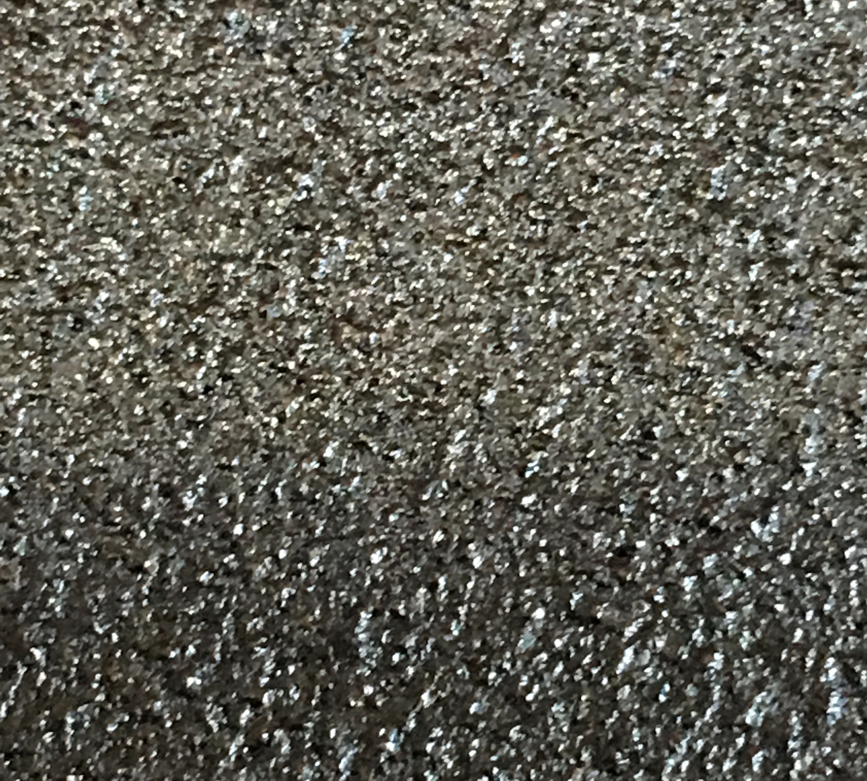 Typical surface of a standard pan. Who would want to cook food on sand paper?
