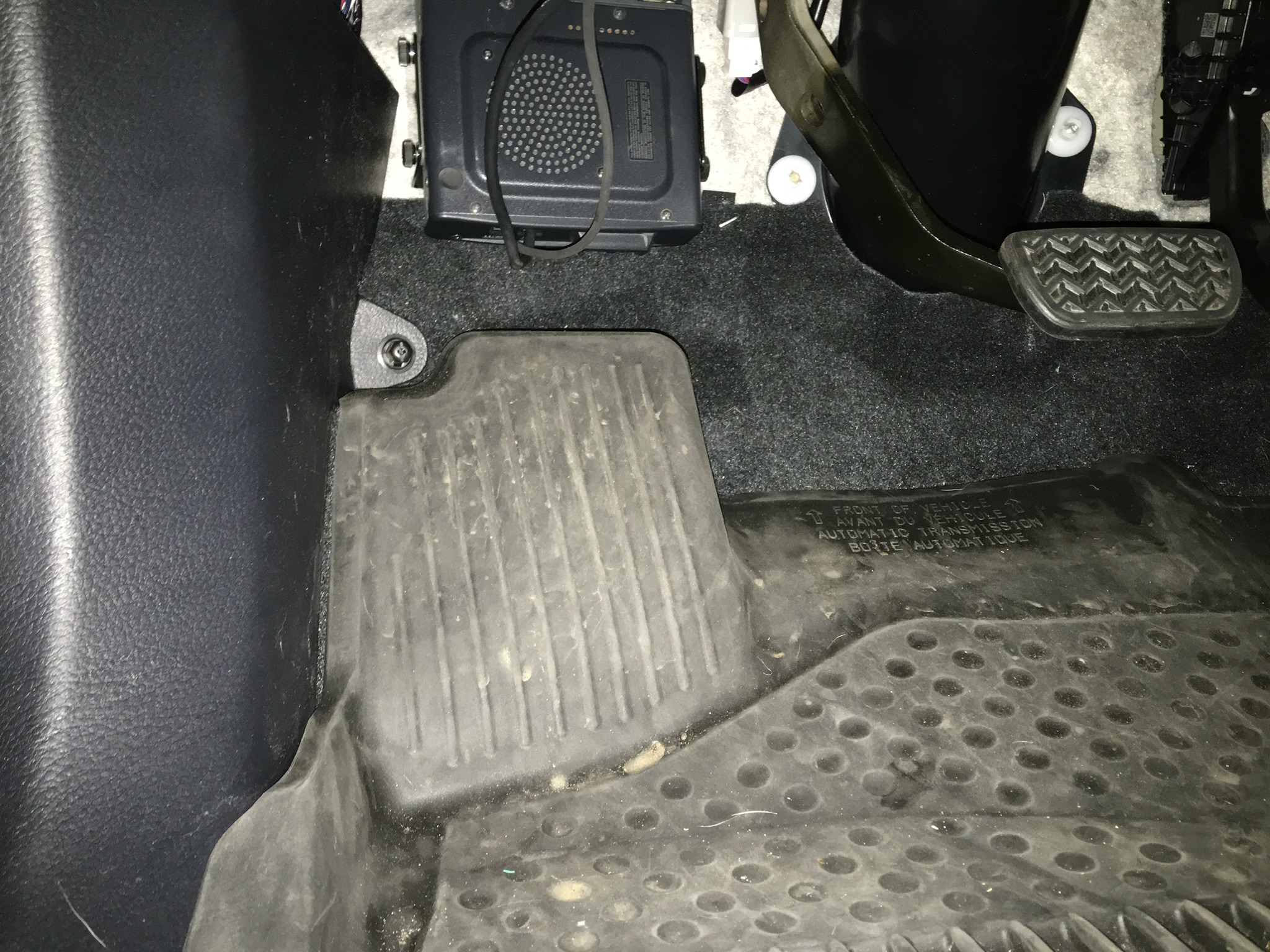 The base unit is mounted under the dash on the drivers side firewall.
