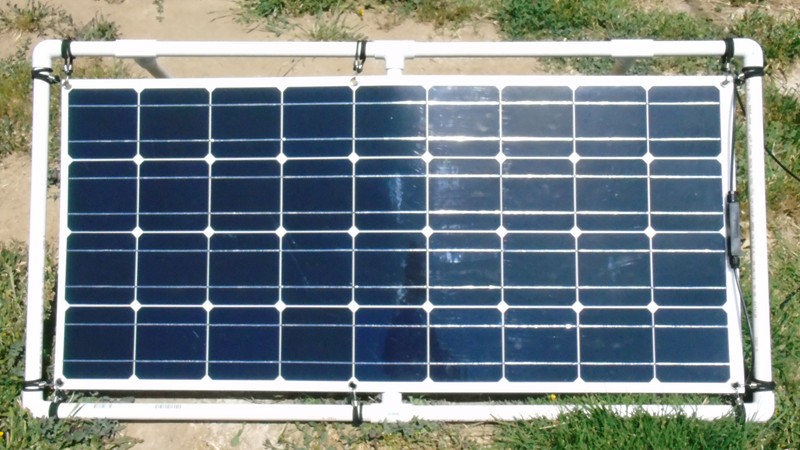 A 120-watt semi-flexible panel held in a PVC pipe frame with adjustable legs that can be oriented either horizontally or vertically.