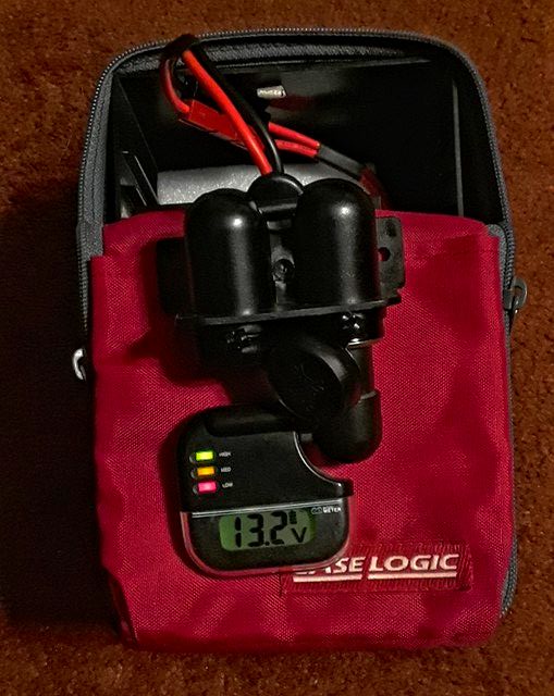 I went soft case on this one.  This is a CD case found at a thrift store with a little padding for protection and room to put extra connections and accessories.