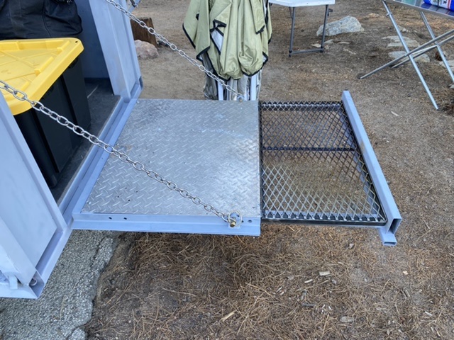 Dutch oven cooking surface drops in to the slide out and is stored under the ice chest.