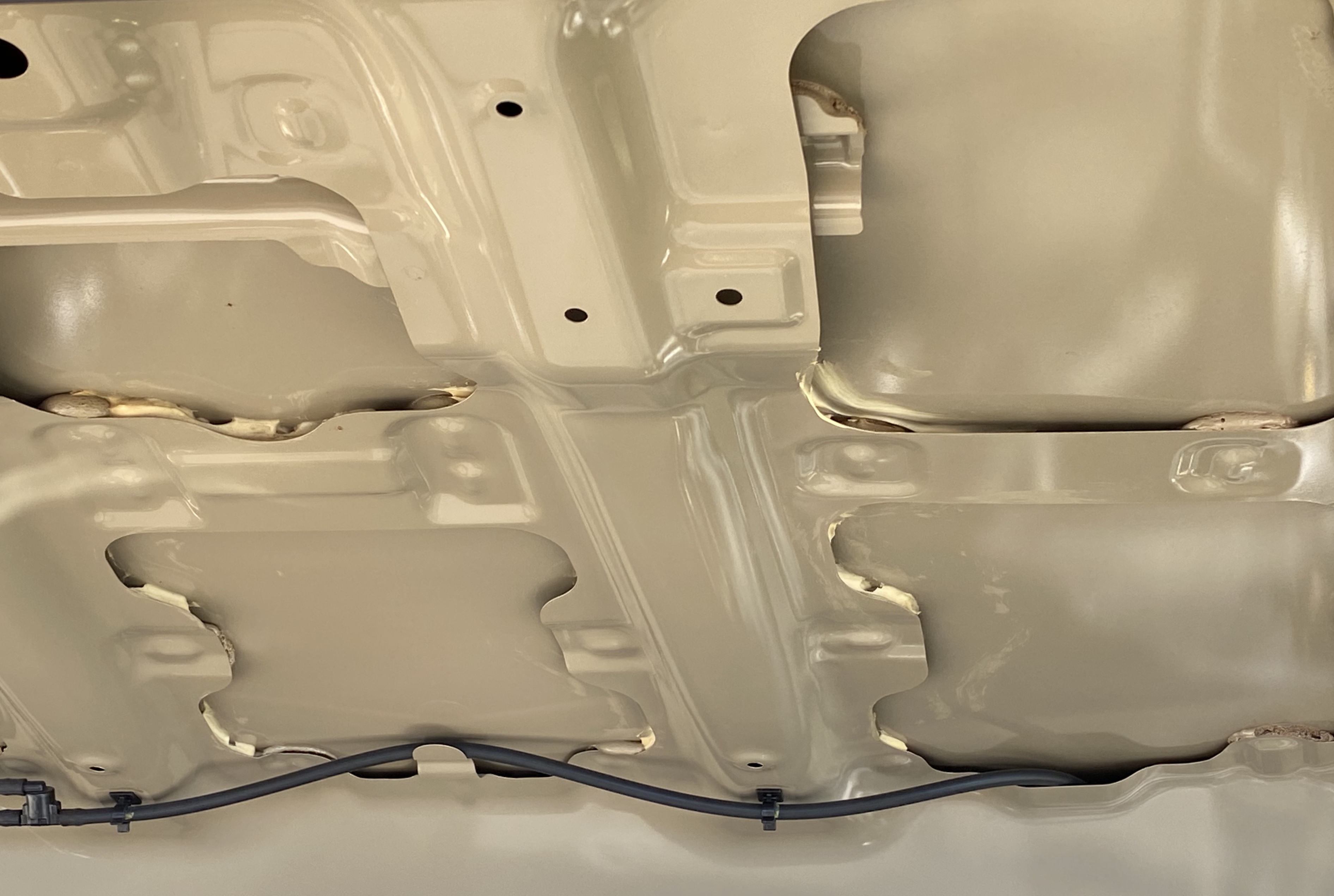 Tacoma hood showing skin on frame.