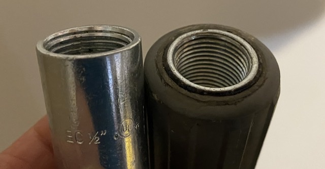 1/2” electrical conduit connector glued into a military tent pole make a great way to attach a copper J-Pole to the top of your mast.