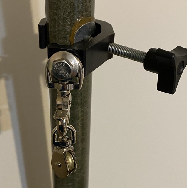 The addition of an epoxied washer allows me to rig a clamp with a pulley to hoist an end fed antenna on the same mast