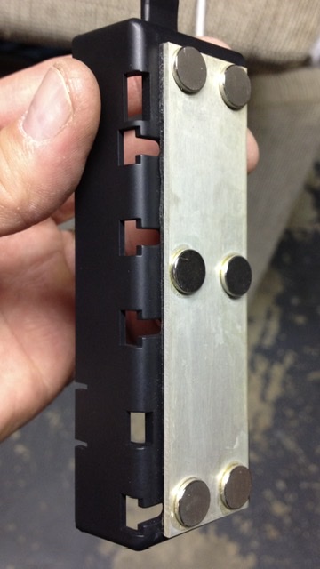 I used a Rear View Mirror adhesive to bond neodymium magnets the the mounting plate.