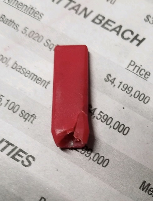 The switch sleeve is badly cracked and chipped due to age and the heat of the compressor. I would suggest a hybrid adhesive like Loctite HY 4070 to keep the old part or use an epoxy putty to build a new one.