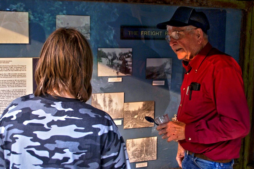 This &quot;Old Timer&quot; was describing to this &quot;Whipper-Snapper&quot; the reason the smoke stack was missing on the steam engine in a photo on the display.  When he finished his explanation the rest of the story was, he was on the train when they hit a low hanging, snow laden limb.