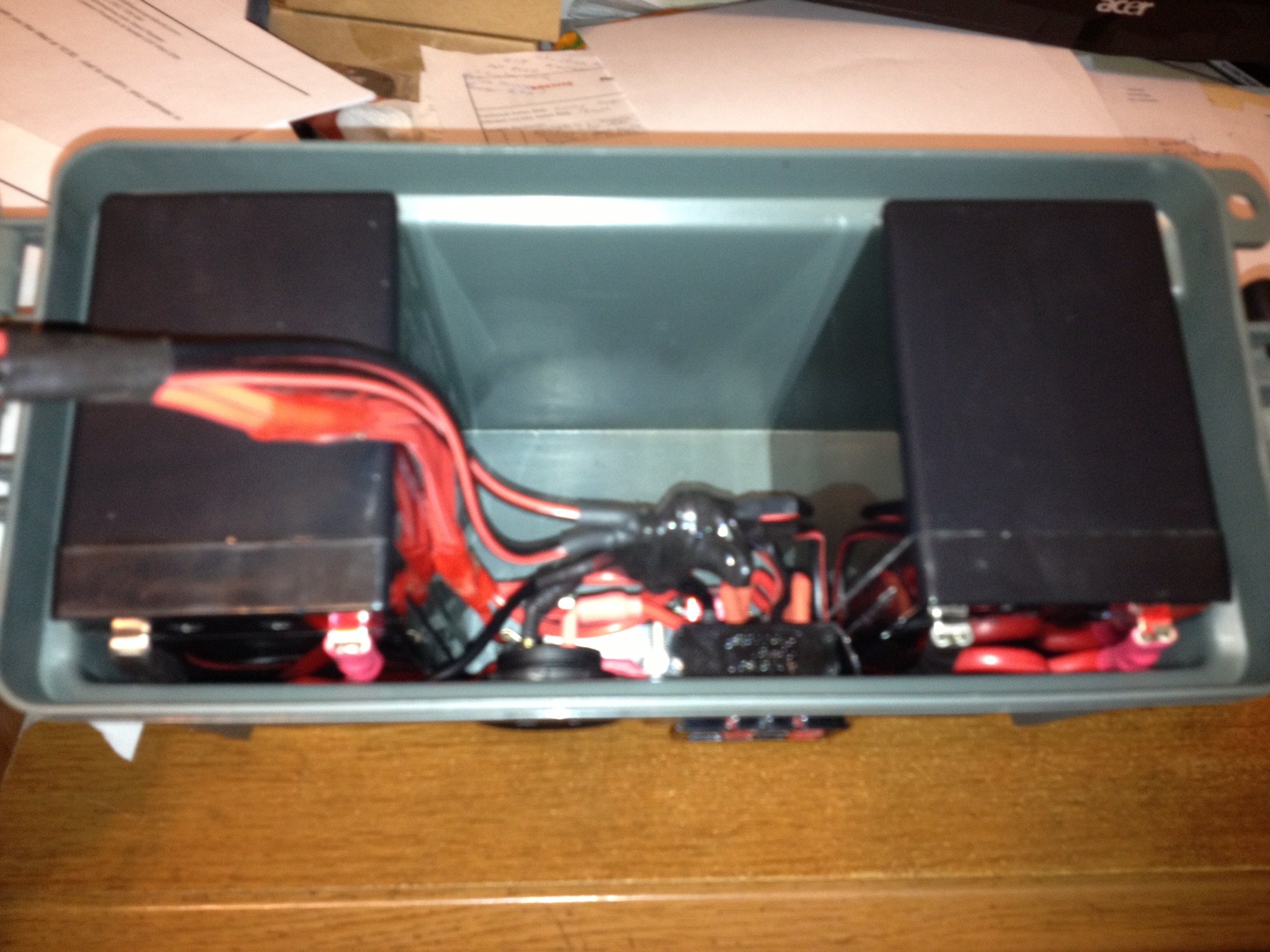 I used a smaller 30 caliber plastic case to house two 7a/h SLA batteries. I recently replaced the two batteries with one Lithium battery which actually offers a similar storage capacity.