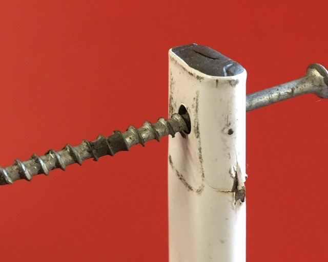 Clean out the bolt hole with a screw or stick