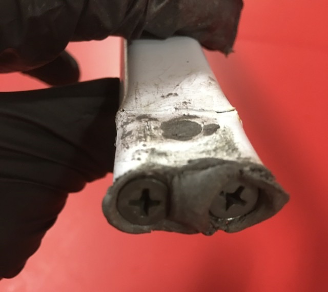 Drive drywall screws, nails or sticks into the end to reinforce the damaged metal.