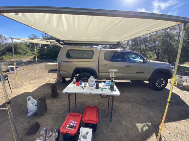 Some type of awning, tarp or other means of getting out of the elements helps define your camp site and creates a more enjoyable experience