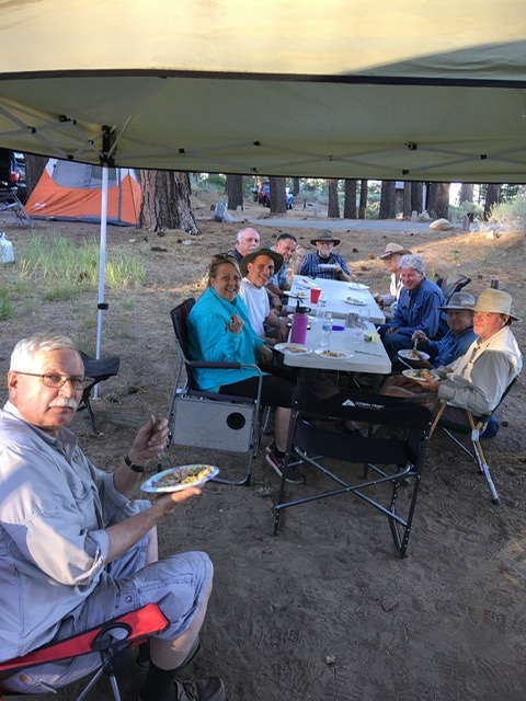 If I can bring only one chair, I prefer one that is more upright vs a lounger. An upright allows easier dining, radio operating and conversing. I would higher recommend one with a fold up side table.