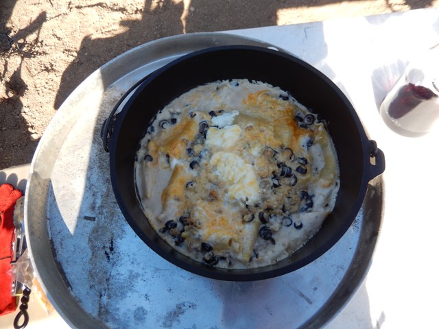 Lasagna with a little different make up: Noodles were cooked at home and chilled before the trip. Alfredo sauce, olives, ricotta cheese, chicken breast pieces (also pre-cooked), layered in the DO, spiced to taste and set for 350° for about 45-60 minutes...long enough to get it all warmed and gooey-ed up.