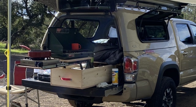 My goal was to carry what I need safely hidden and secure under the deck/bed platform but still be able to access and use everything without having to place items on the ground, especially at night.