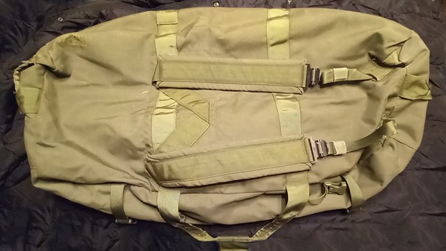 Heavy duty handles at both ends of the bag; nice placard pocket that does well to mark and provide a place to put a packing list (potential for a go-bag?)