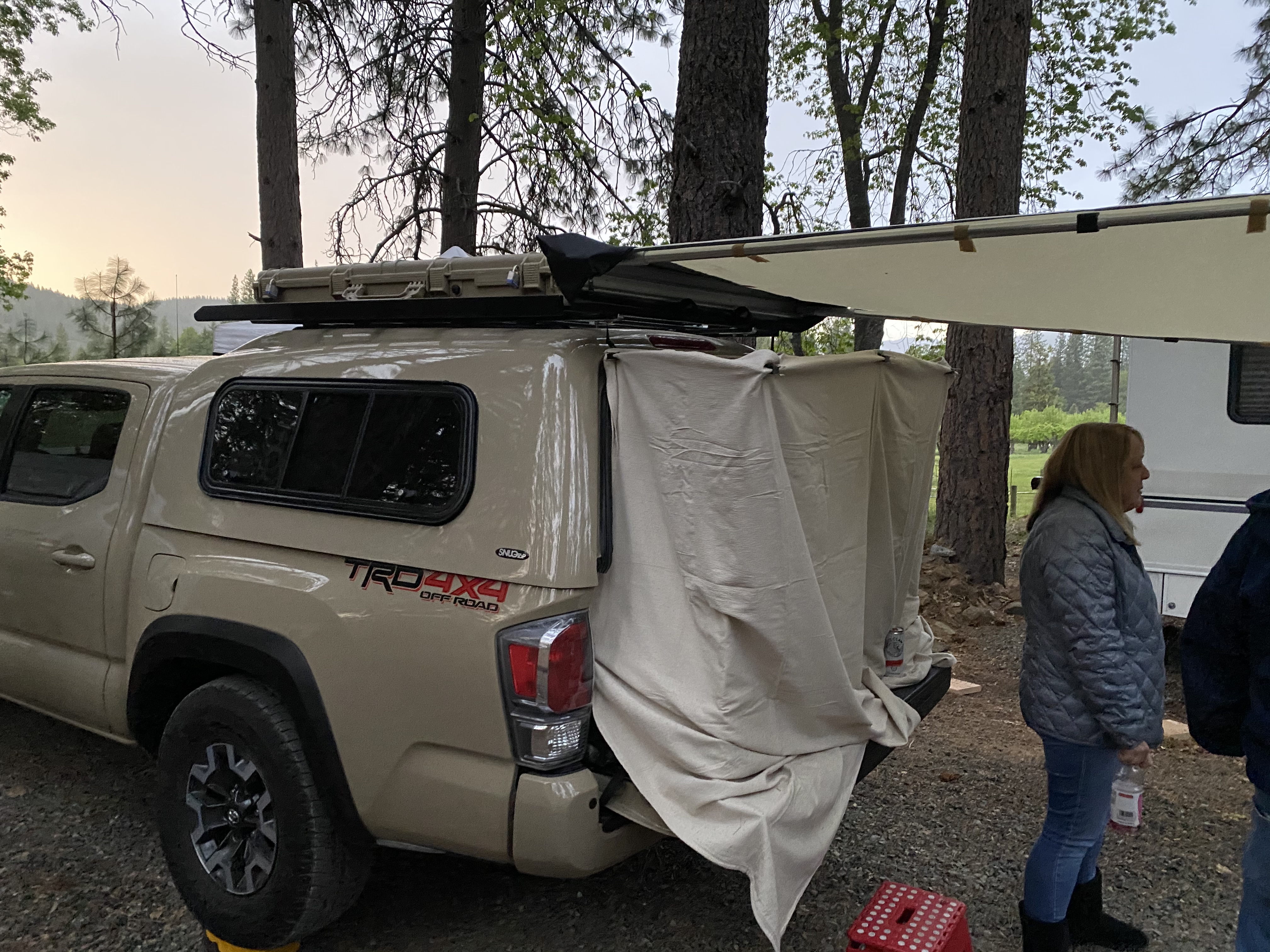 Waterproofed, Canvas drop cloth clamped over the lift gate provides extra bed length and a decent amount of protection from wind and critters while allowing easy entry and exit.