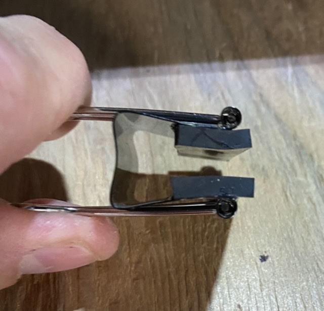 Binder clips with 1/8” rubber Glued to the inside for glass protection and a non slip grip.
