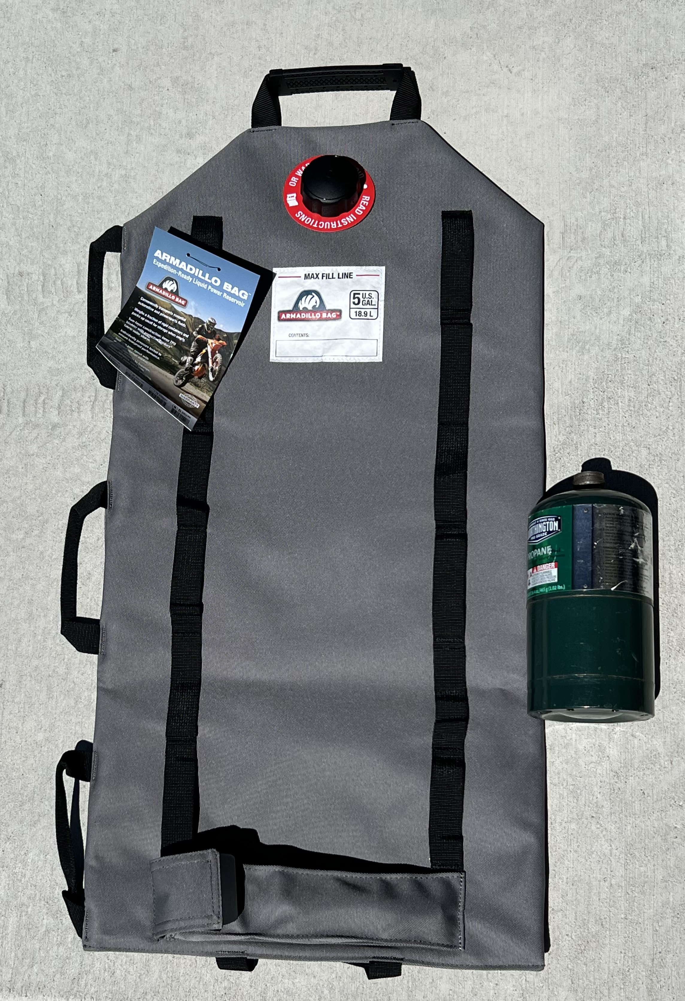 This is the 5 gallon size. 1lb propane cylinder for comparison. Each comes with a detachable pour spout in its own compartment.
