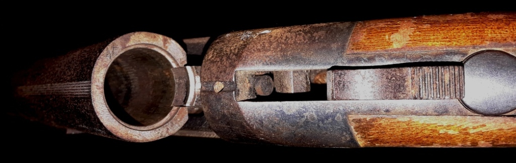 Single-Shot, 12GA, breech loaded, shotgun with auto extractor.  No manual safety, no half-cock and no transfer safety bar.