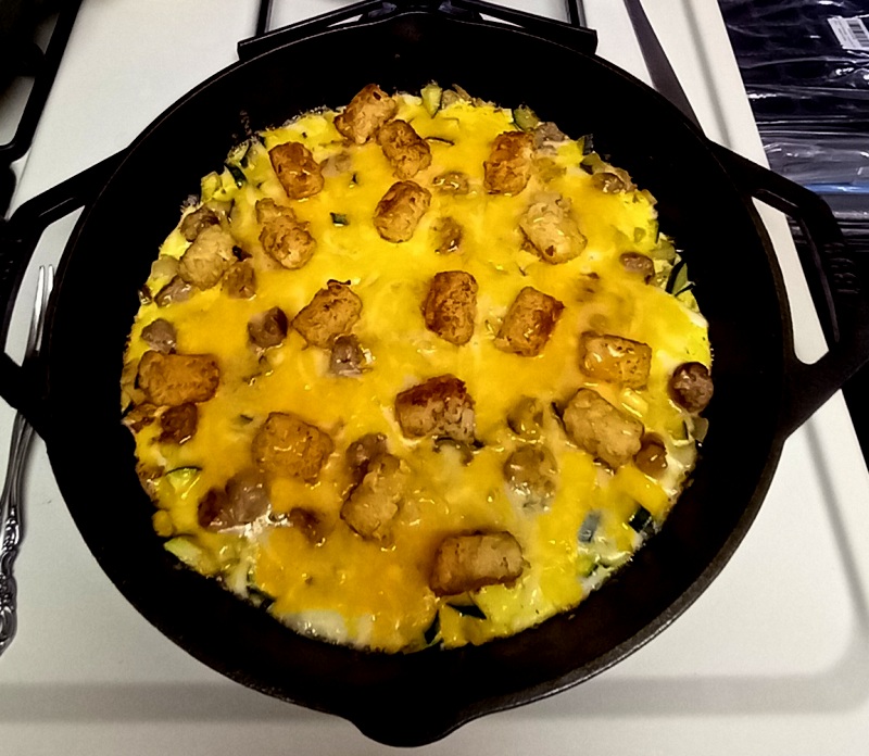 So, here we go. Anything that you can do in the oven you can duplicate in some manner with cast iron cooking. You just have to hone your technique. Here are some examples of meals I happened to have on my cell phone to share. This is a breakfast meal with leftover tater tots, sausage, probably onion, a few eggs stretched with some milk whipped in allowed to cook in a 12&quot; skillet with a cast iron lid. This is a very common technique used when the family eats together. I call this &quot;Egg Pizza&quot; because we do not flip or stir once the egg is added and there is usually a dark bottom to this with a fluffy top. It is critical to use medium to low heat once you put in egg and allow the cheese to melt over the top of everything.