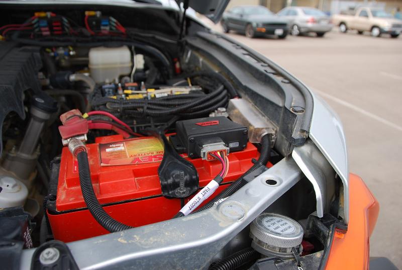 The wireless control box is on the battery and the driver side compressor intake is the round disc you see above the turn signal.