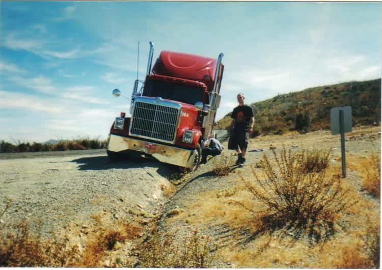 Stuck in a rut, Otay Mountain, San Diego, CA. Drifted into this rut at low speed while looking over my shoulder, and it took us three hours to dig ourselves out. Best lesson I ever imparted to my nephew and his friend Brian: self-sufficiency in the field.