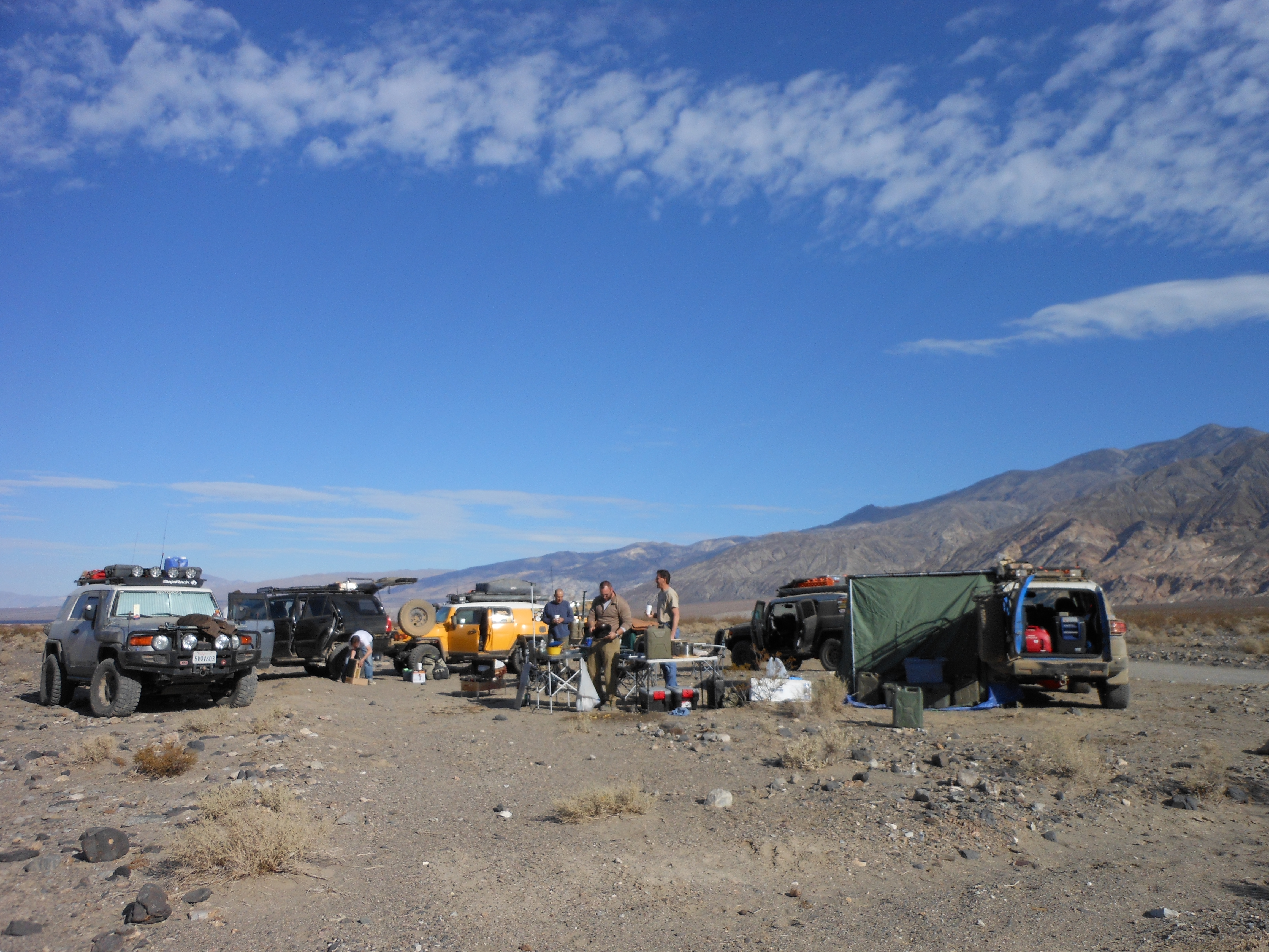Campground and kitchen facilities under clear, sunny skies
