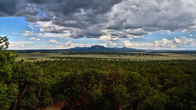 View from my buddy's newly acquired porch/place.  Another HDR, several photos layered together, higher ISO (handheld), tri-burst -0.7, 0.0 and +0.7 exposure.  A hill mass near Datil, NM about 7 miles east; part of the &quot;Sawtooth Mountain&quot; mass.