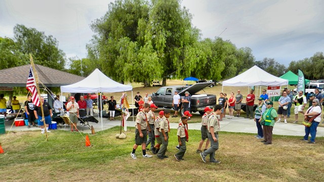 Troop 2 Boy Scouts move out smartly after posting The Colors