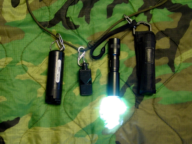 EDC size flashlight, emergency whistle and non-lethal.