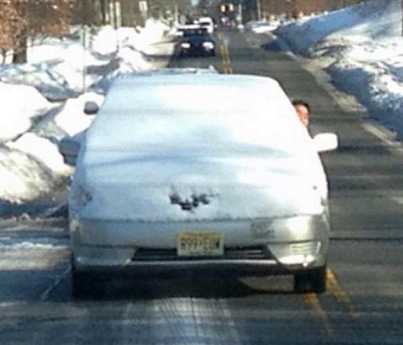 if this driver was to hit brakes all this snow on roof could slid down onto windshield