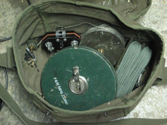 The heavy bag of tricks with the N connector fed balun and tape measure that was part of the kit.  This is a workhorse of an antenna but heavy.  The load was usually split between the RTO and the ARTO.  Field expedient wire antennas were the favorite &quot;go-to&quot; item but it took a working knowledge of how to make the best out of your &quot;system&quot; that got the best results with our AN/PRC-104.  I learned to love on attaching point antennas because the logistics of raising a horizontal dipole in the woods was like raising a flag for others to find you under.