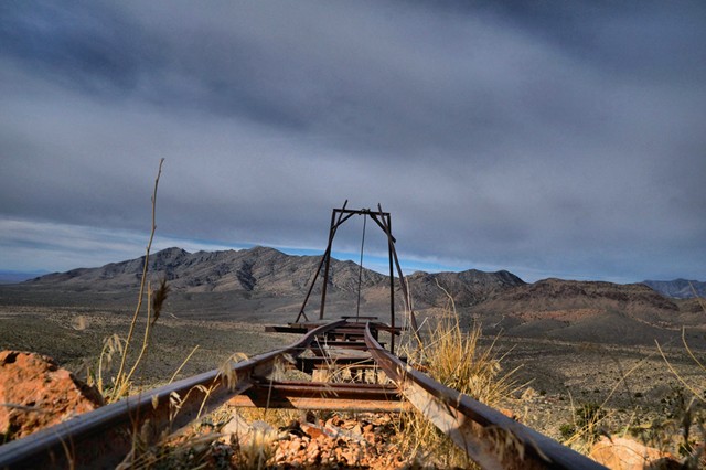 25.  Ore cart rails seem to all end at the end of a tailing pile or a drop off, why?
