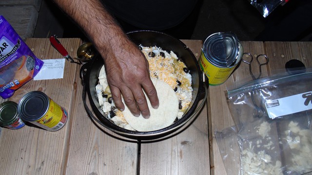Chicken Enchilada with shredded chicken, green <br />enchilada sauce, cheese, olives and more cheese...