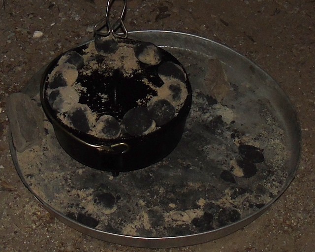 Good equipment, re-purposed items like this water heater tray, help to keep your fire &amp; ashes under control.