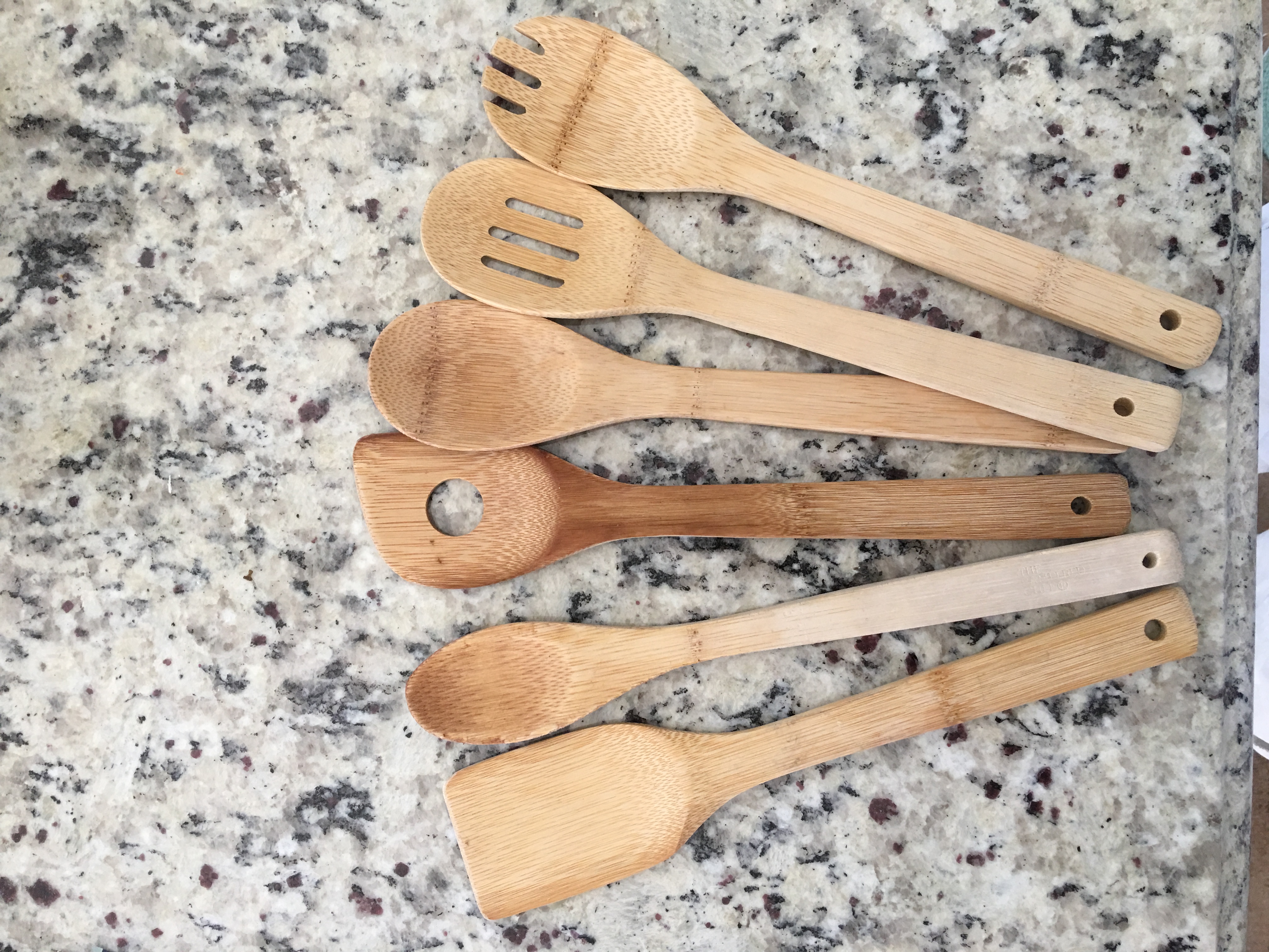The benefits of Bamboo are that they won't damage the non stick surface of the Cast Iron, they can be used to scrape stuck on food, they are a stable wood(technically a grass). In addition, they can be sanded down to match the profile of a particular pot. They also just feel right when used with and iron pot.