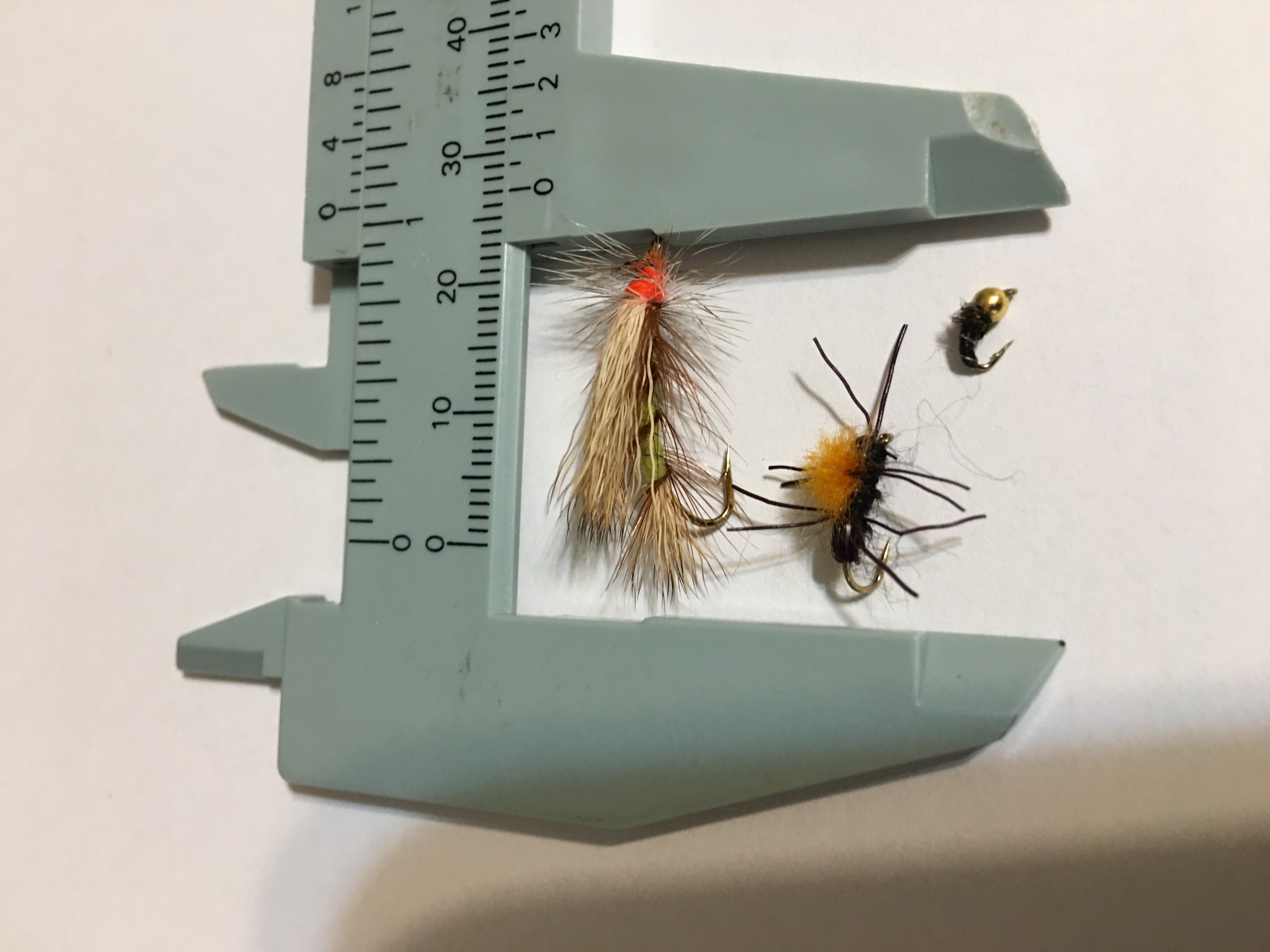 Yellow stimulator, parachute ant, bead head nymph.