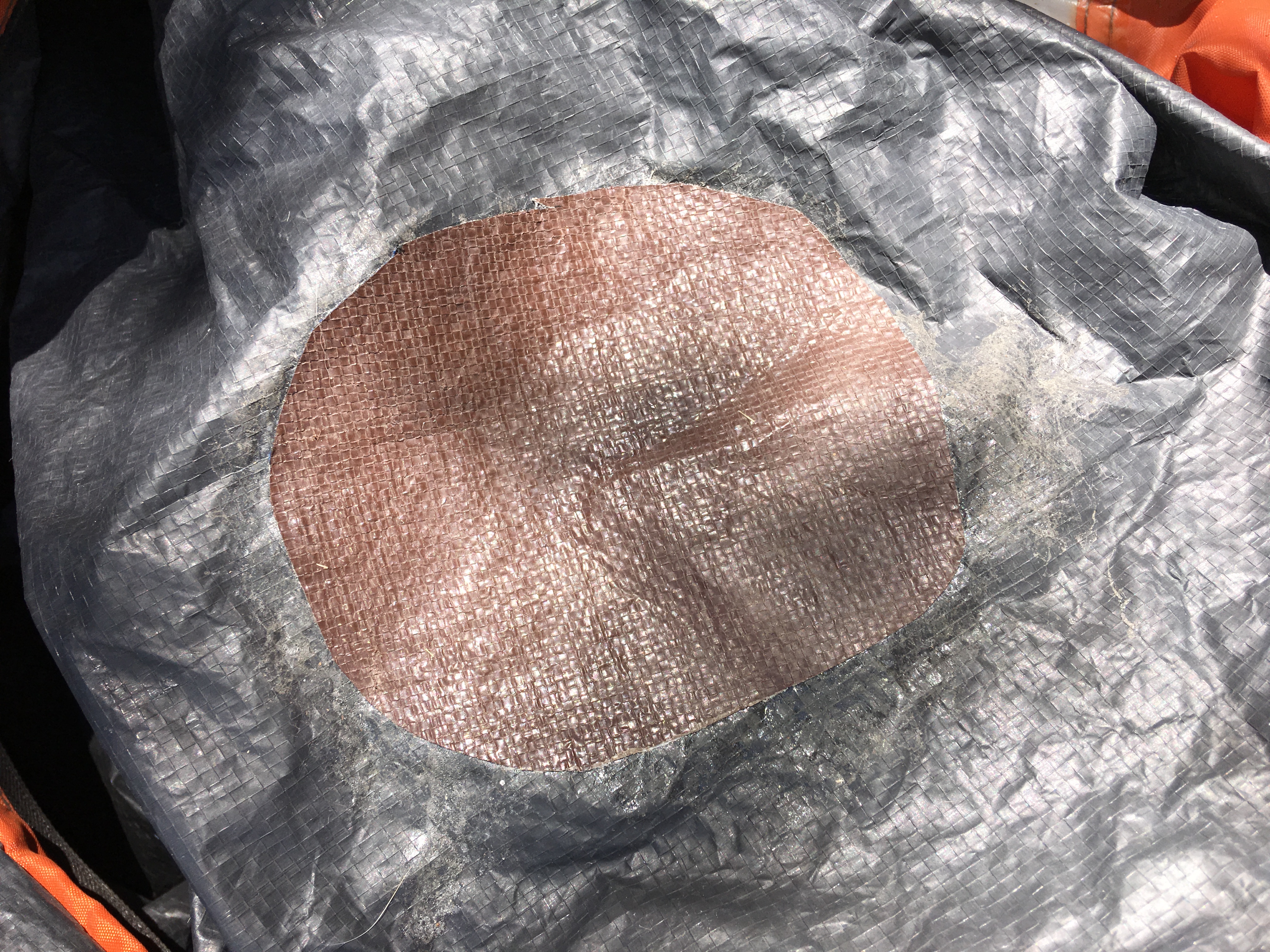 Tent floor repaired with contact cement. Apply glue to each surface, let dry for a few minutes and carefully press parts together. Durable and waterproof.