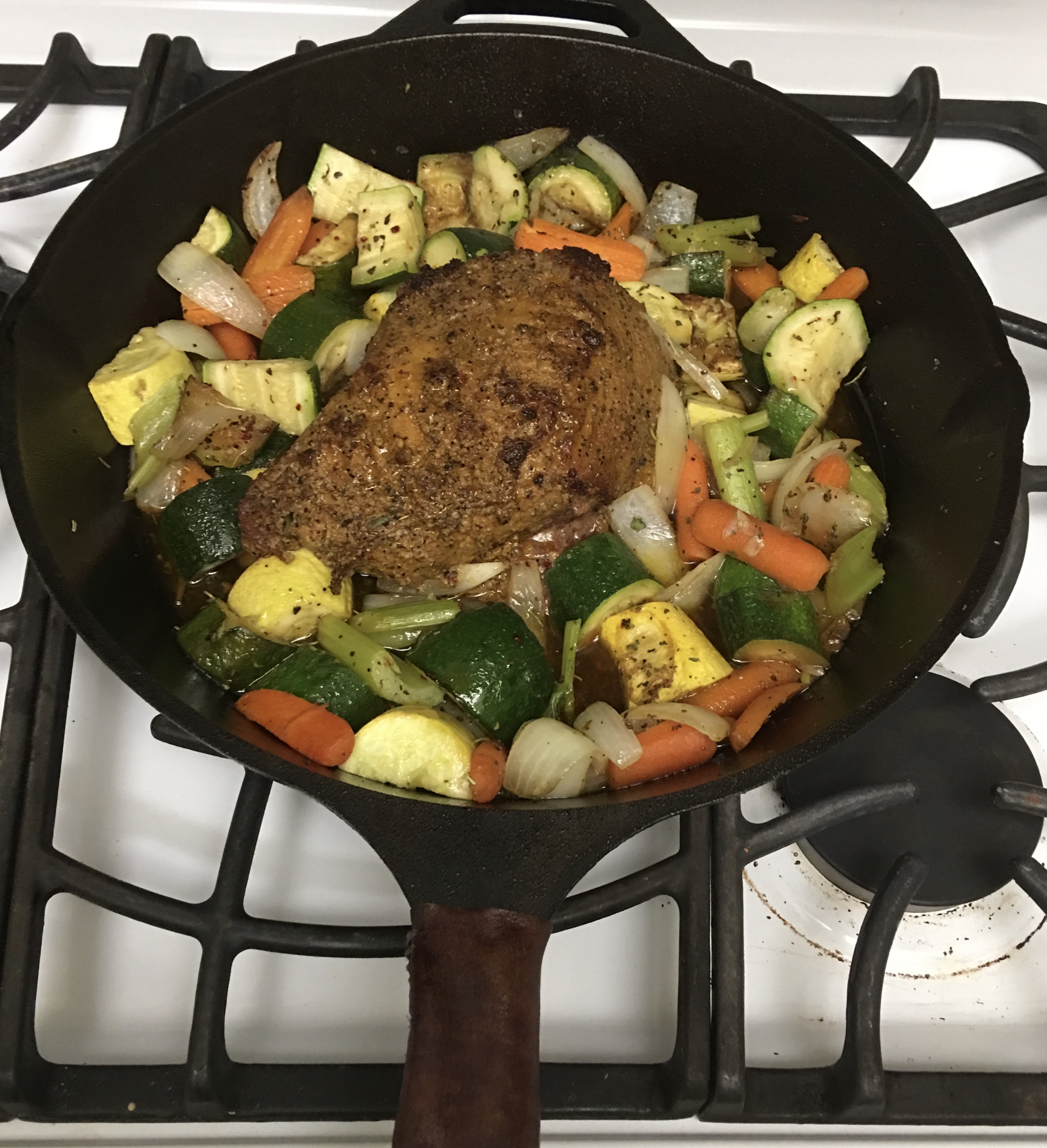 Lid to small Dutch oven used to sear a ribeye on the stovetop. Vegetables were the added to pan and finished in the home oven