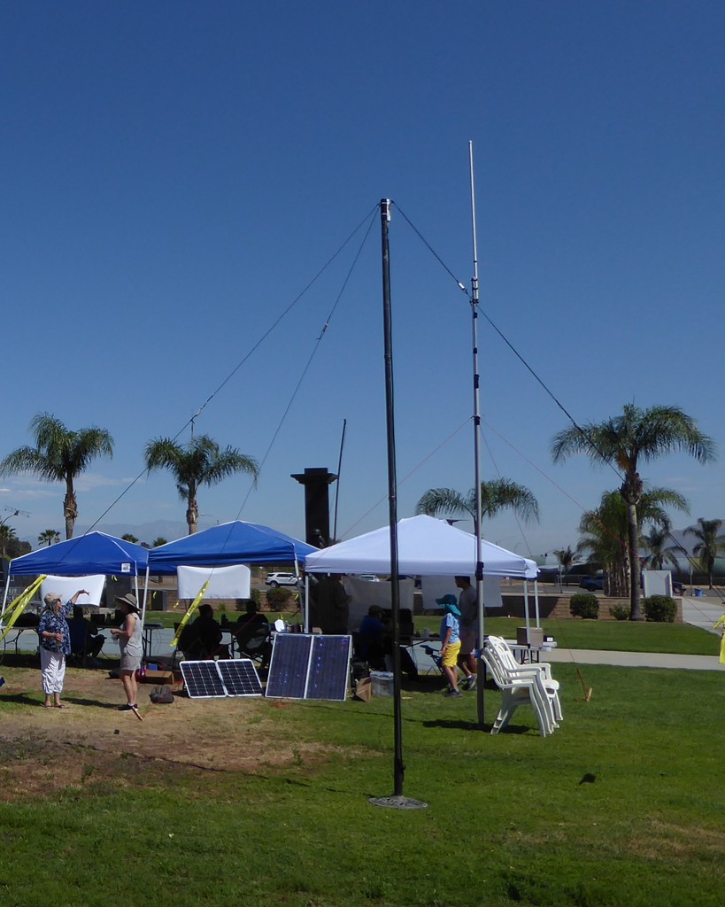 Off grid power is a consideration and you see some very good examples of solar power being put to work. The wire antenna out of the patio umbrella base; a 6m & 10m inverted V out of a 1:1 balun.