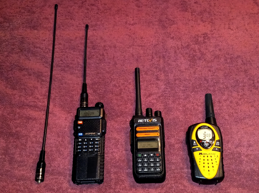 Examples of the platforms we use with respect to HTs. From L-R, enhanced rubber duck, common. amateur radio, Baofeng, dual band HT, Retevis GMRS HT and a Midland FRS HT.